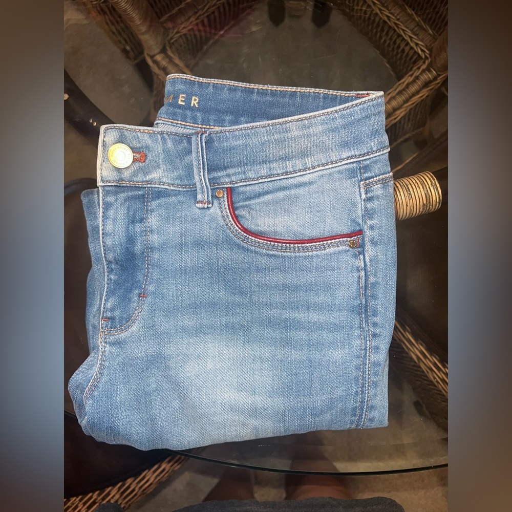 Woman’s blue jeans size 4 with zippers on the bottoms